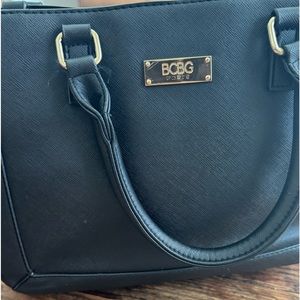 Vintage Parisian Chic: (Like-New)BCBG Handbag in Classic Black